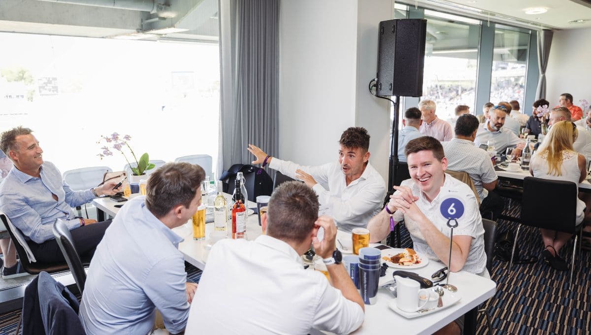 A group of people enjoying food and drinks.